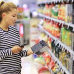 Woman Reading Product Label