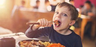 Boy Enjoying Lunch