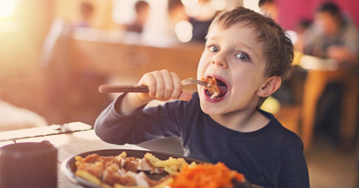 Boy Enjoying Lunch