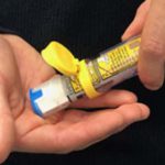 Epipen sticks to carrier tube