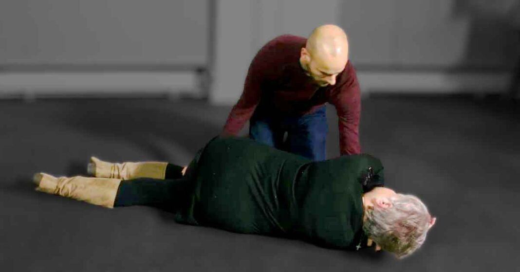 Man Positioning Woman for EMS