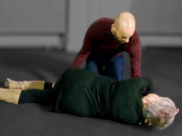 Man Positioning Woman for EMS