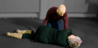 Man Positioning Woman for EMS