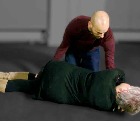 Man Positioning Woman for EMS