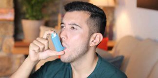 Man Using Inhaler