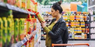 Woman Reading Product Label