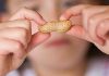 The Hidden Risk for Younger Siblings: Why Early Peanut Introduction is More Critical Than Ever Boy Contemplating a Peanut