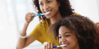 mother-and-daughter-brushing-teeth