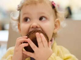 Toddler Eating Muffin
