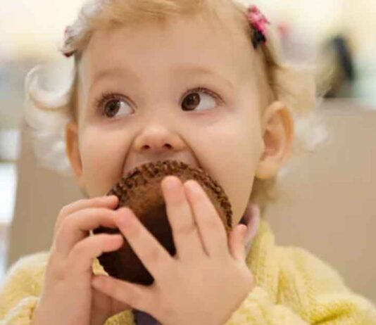 Toddler Eating Muffin