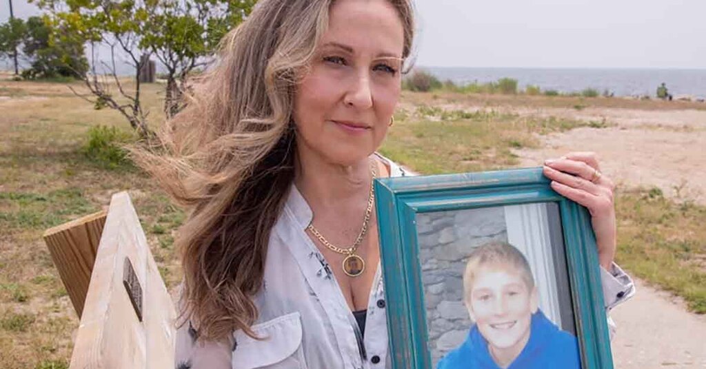 Georgina Cornago Holding Photo of Son Giovanni Cipriano