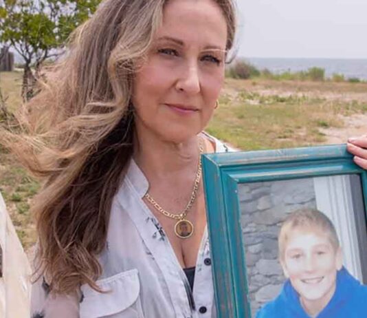 Georgina Cornago Holding Photo of Son Giovanni Cipriano