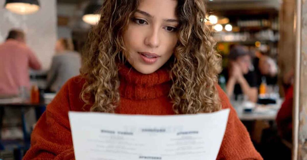 Woman Studying Menu