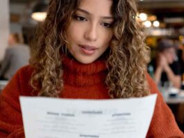 Woman Studying Menu