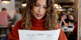 Woman Studying Menu