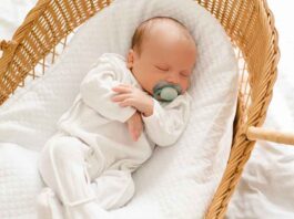 Newborn Sleeping in Bassinet
