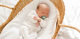 Newborn Sleeping in Bassinet