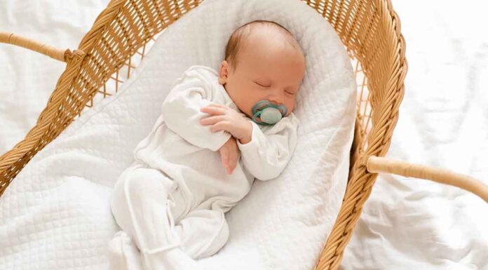 Newborn Sleeping in Bassinet