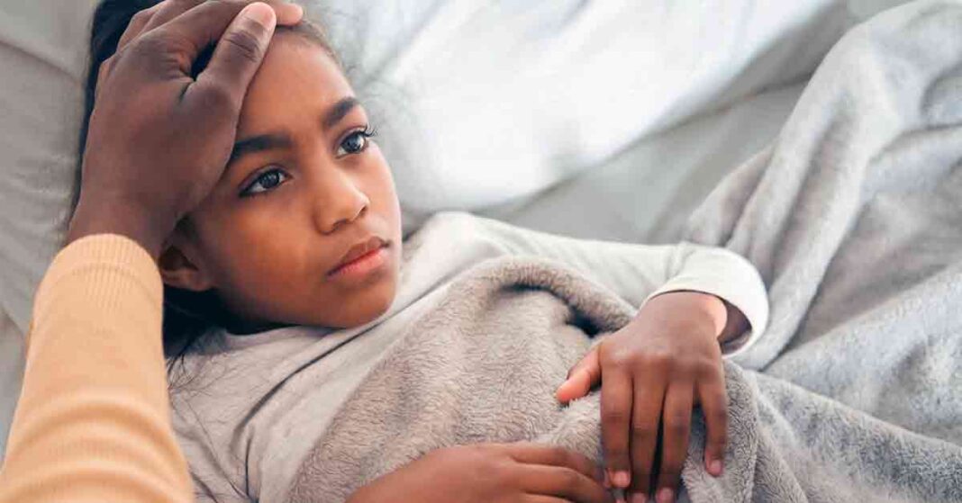 Girl in Bed with Tummy Ache