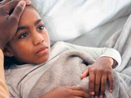 Girl in Bed with Tummy Ache