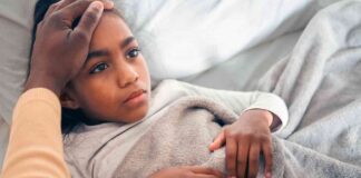 Alpha-Gal Syndrome in Kids: Why the “Red Meat Allergy” Often Hides in Plain Sight Girl in Bed with Tummy Ache
